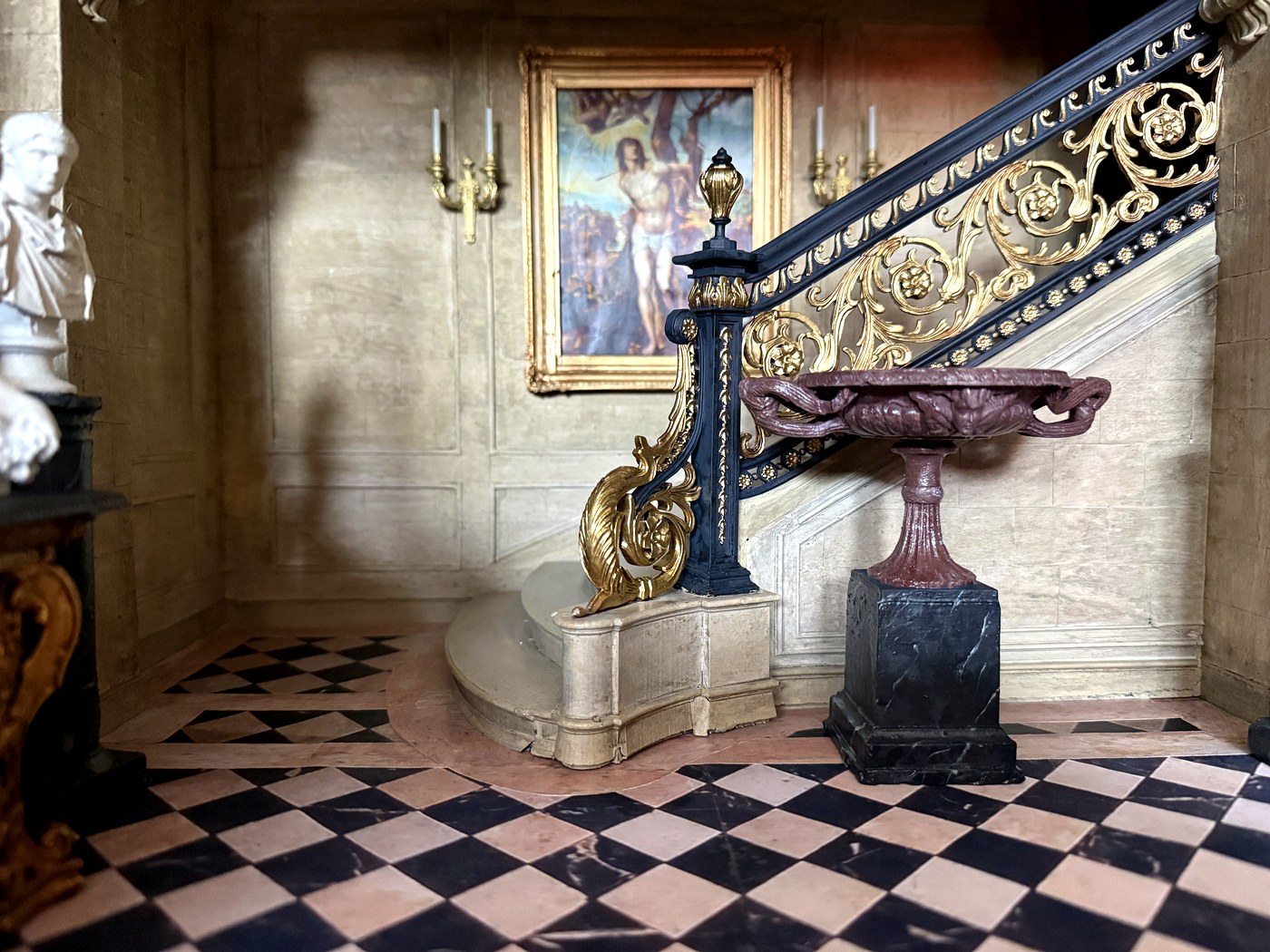 Staircase base with gilt ironwork detail